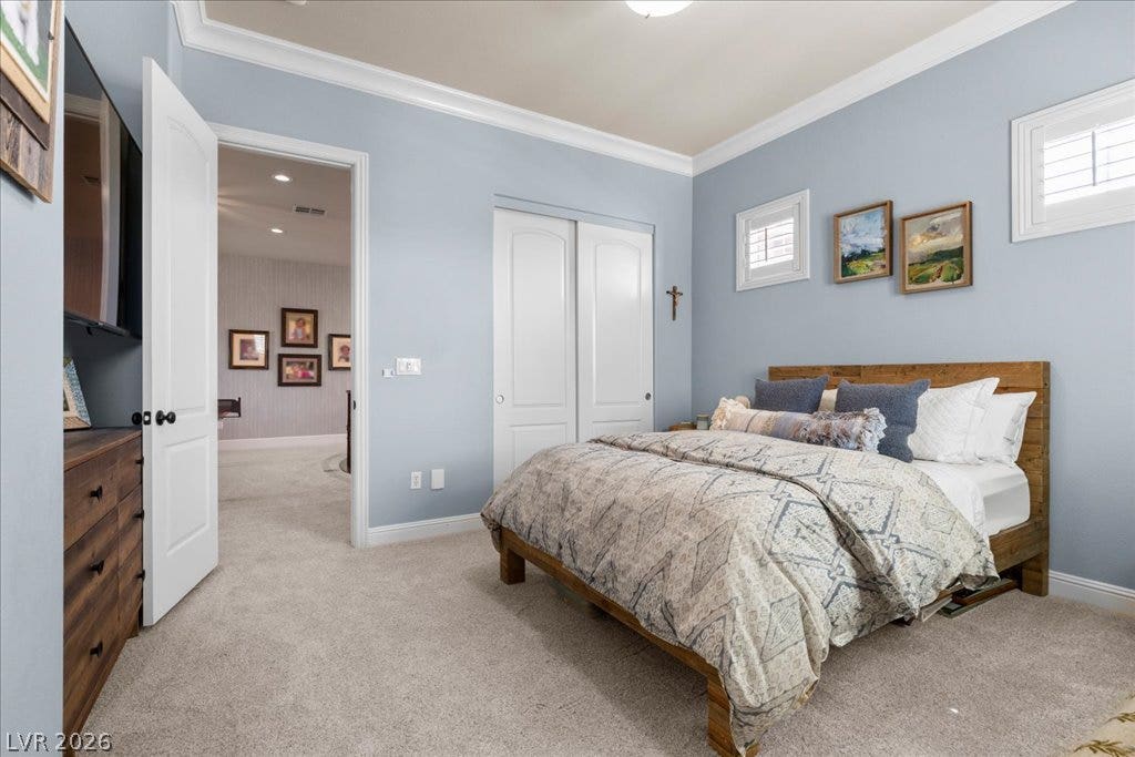 2985 American River Lane, Las Vegas, NV 89135 Bright bedroom with elegant finishes and soft carpeting.