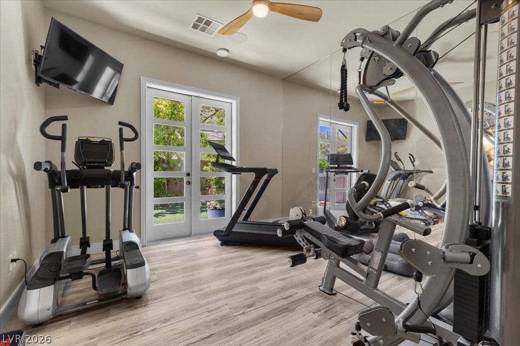 2985 American River Lane, Las Vegas, NV 89135 Fitness room with French doors and natural light.