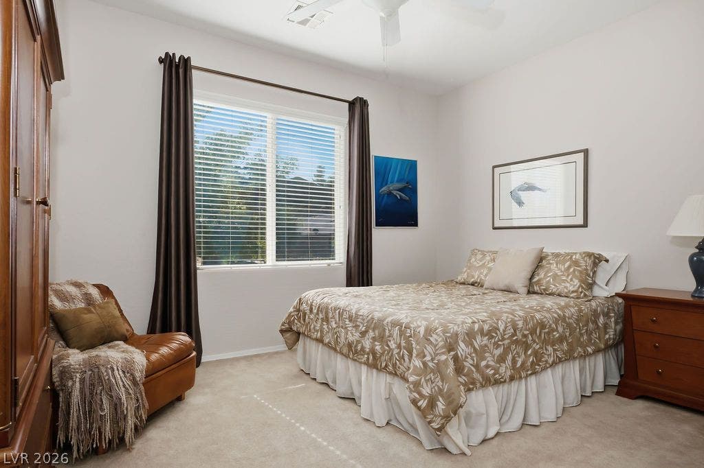 2510 Hamonah Drive, Henderson, NV 89044 Soft carpeting pairs with a large window in this peaceful sleeping space.
