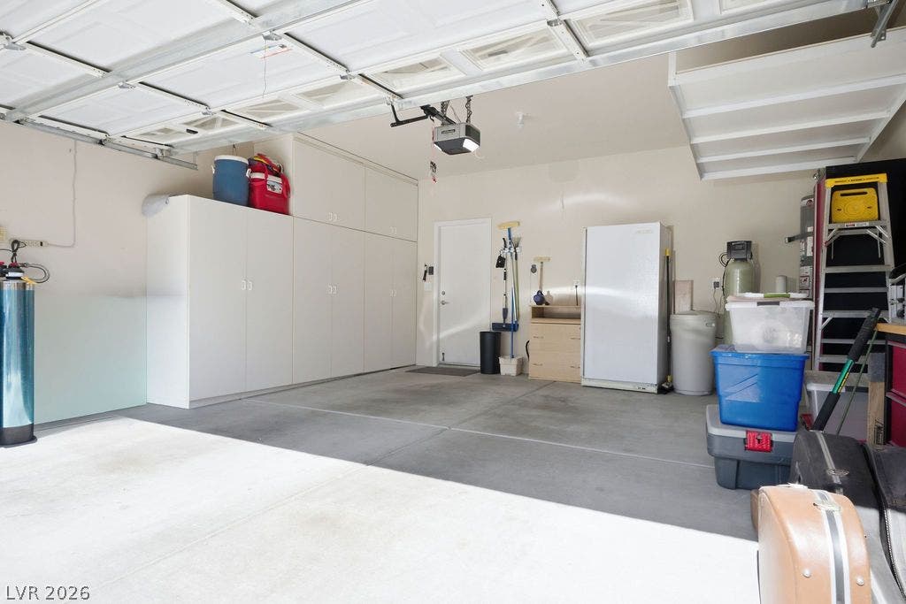 2510 Hamonah Drive, Henderson, NV 89044 Ample built-in storage cabinets line the walls of this clean concrete floor garage.