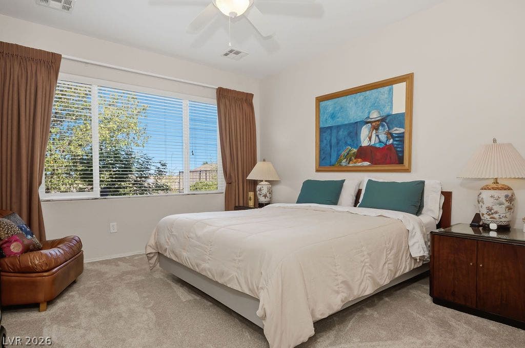 2510 Hamonah Drive, Henderson, NV 89044 A wide window illuminates the plushly carpeted bedroom space.