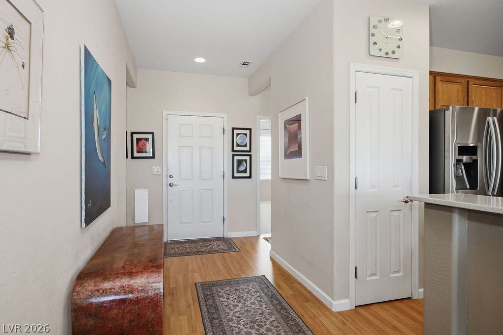 2510 Hamonah Drive, Henderson, NV 89044 Gleaming hardwood floors and a recessed light illuminate the inviting entry hallway.