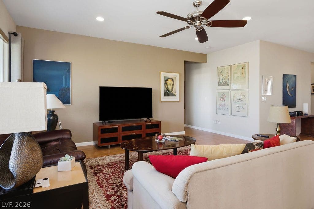 2510 Hamonah Drive, Henderson, NV 89044 Gleaming hardwood floors and recessed lighting anchor this inviting open-concept living area.
