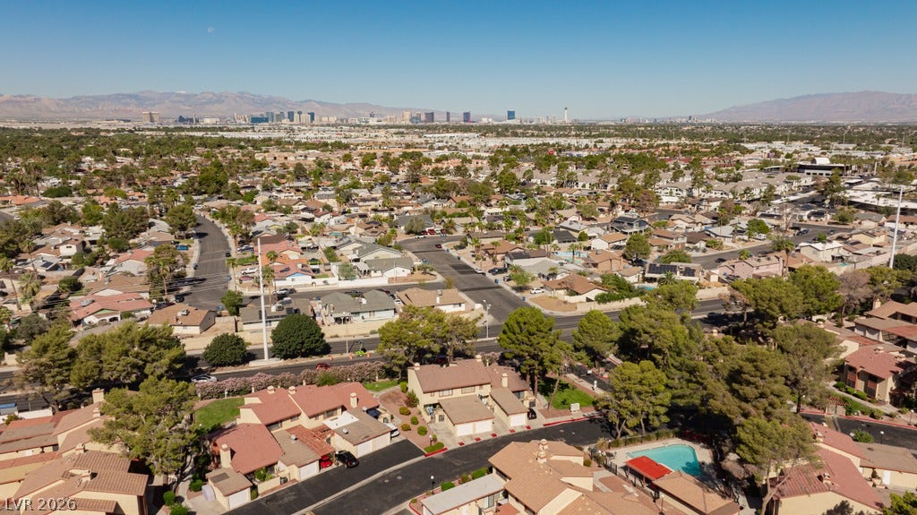 2371 Pickwick Drive, Henderson, NV 89014 Distant city skyline and mountain views elevate this expansive suburban neighborhood setting.