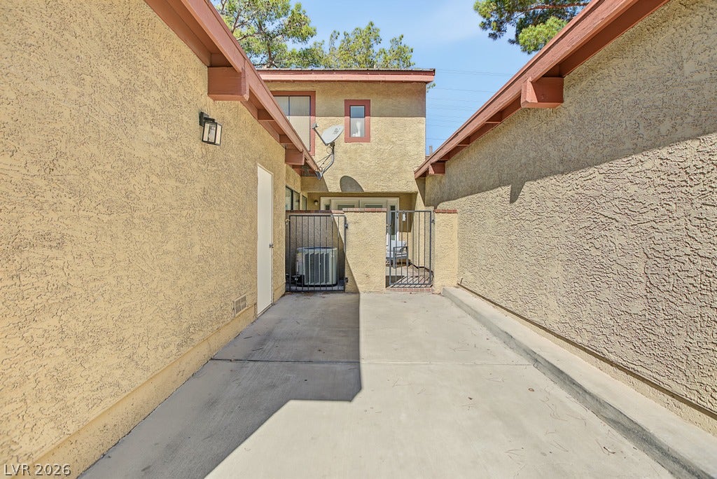 2371 Pickwick Drive, Henderson, NV 89014 Textured stucco walls enclose a private, concrete entryway leading to the gated courtyard.