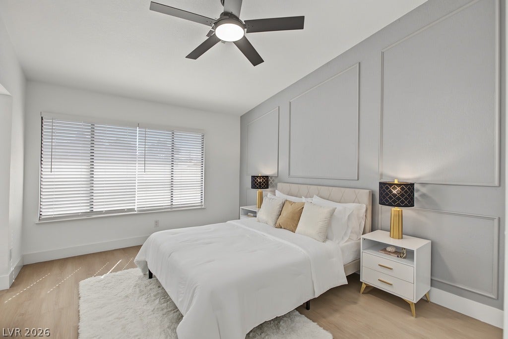 2371 Pickwick Drive, Henderson, NV 89014 Elegant wall molding accents the tranquil sleeping space finished with light hardwood flooring.
