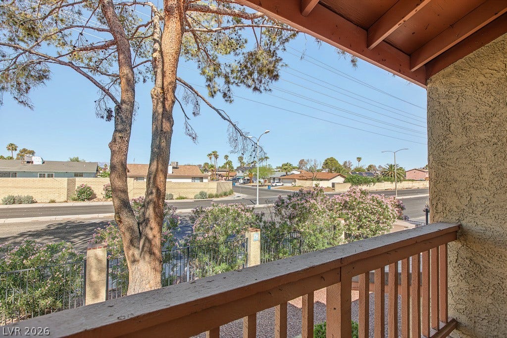 2371 Pickwick Drive, Henderson, NV 89014 Mature trees and neighborhood views framed by a covered upper balcony.
