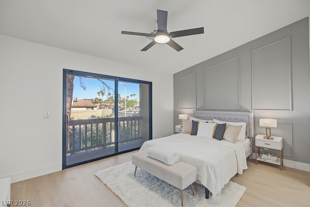 2371 Pickwick Drive, Henderson, NV 89014 Sliding glass doors open to a private balcony from this spacious bedroom.