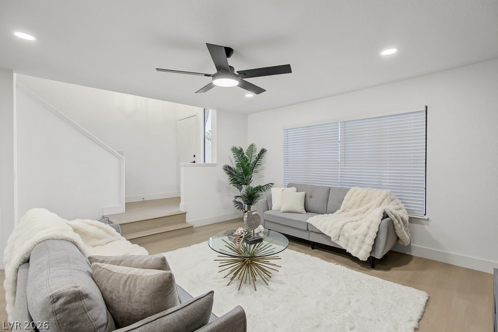 2371 Pickwick Drive, Henderson, NV 89014 Recessed lighting and warm wood flooring anchor this inviting, open living space.