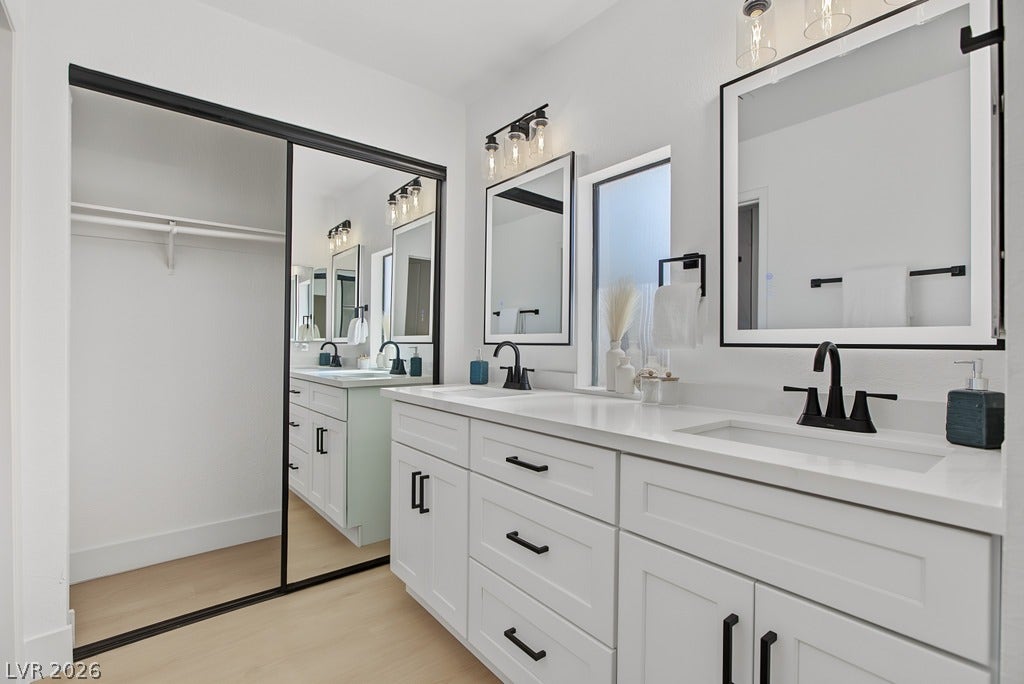 2371 Pickwick Drive, Henderson, NV 89014 Clean lines and modern hardware define this light-filled double vanity layout with mirrored sliding doors.