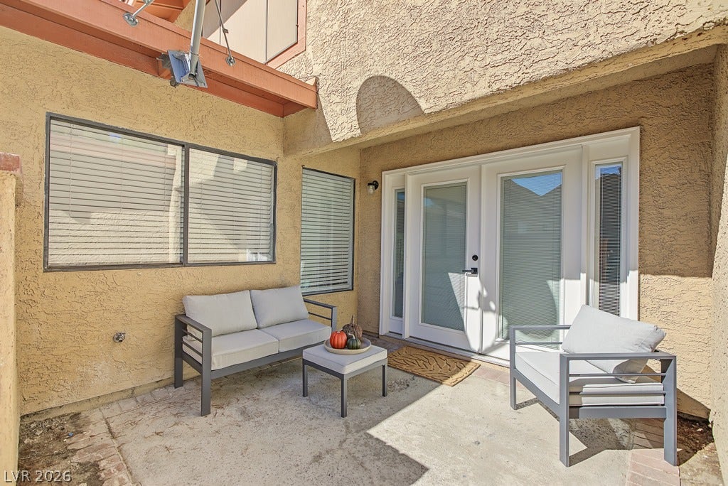 2371 Pickwick Drive, Henderson, NV 89014 Double doors open directly onto a private concrete patio ideal for outdoor relaxation.