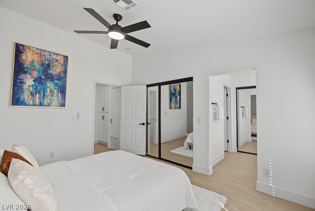 2371 Pickwick Drive, Henderson, NV 89014 High ceilings and clean plank flooring define this serene and modern sleeping space.