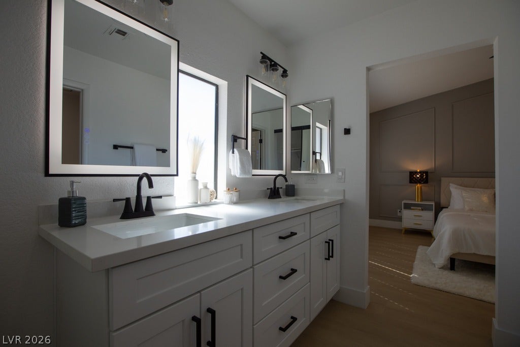 2371 Pickwick Drive, Henderson, NV 89014 Clean lines and a spacious double vanity anchor this modern primary bathroom suite.