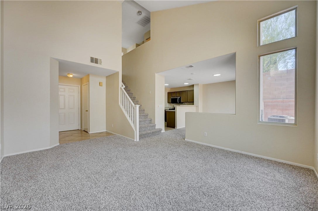 2706 Guidance Court, North Las Vegas, NV 89031 Towering ceilings and carpeted floors define this open interior layout.