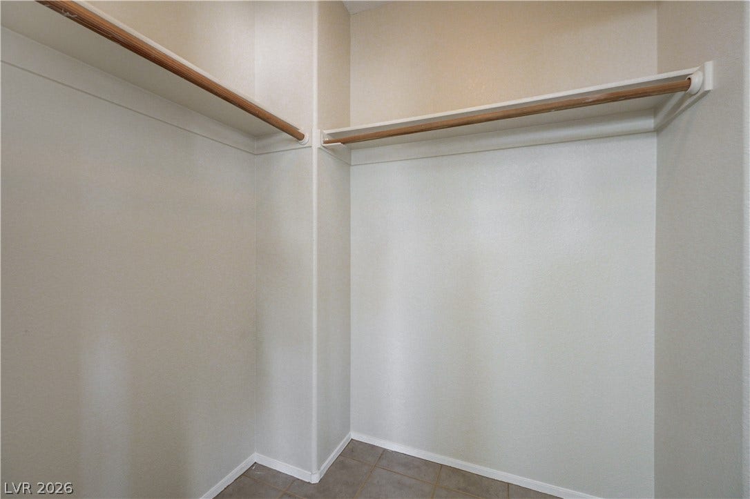 2706 Guidance Court, North Las Vegas, NV 89031 Generous closet space features built-in shelving, wood hanging rods, and tile flooring.