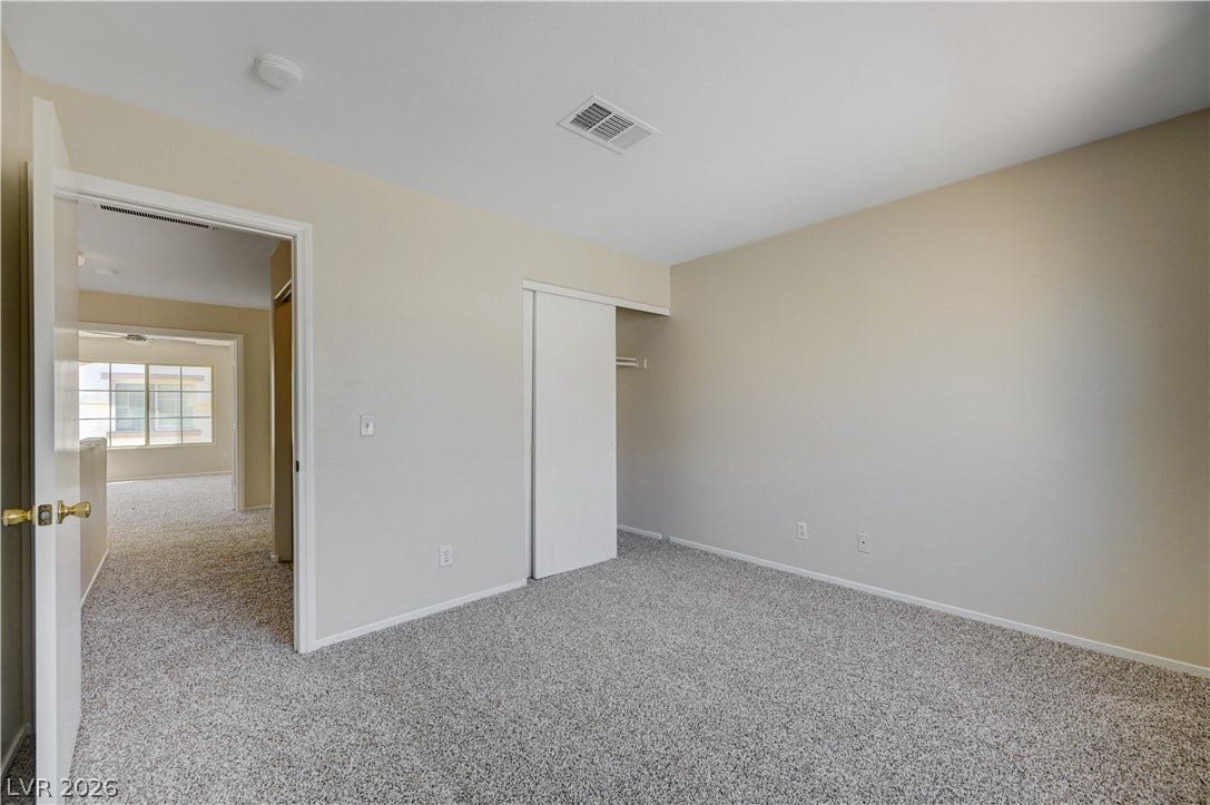 2706 Guidance Court, North Las Vegas, NV 89031 Plush wall-to-wall carpeting and neutral tones define this versatile secondary bedroom space.
