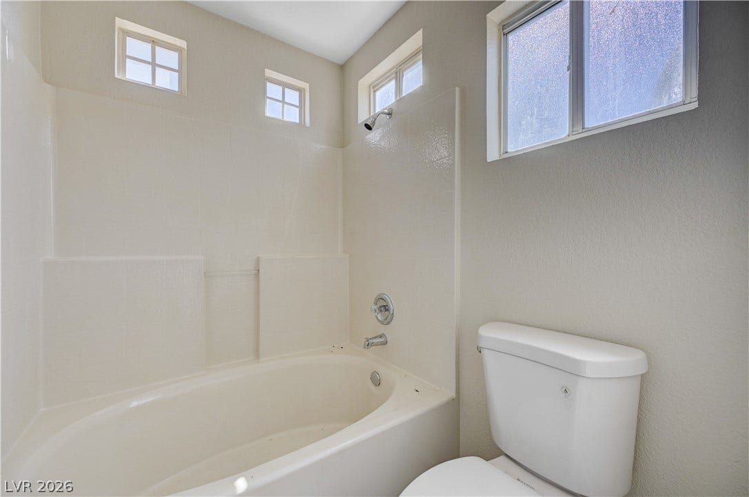 2706 Guidance Court, North Las Vegas, NV 89031 Natural light streams through multiple windows to illuminate this clean and functional bathroom space.