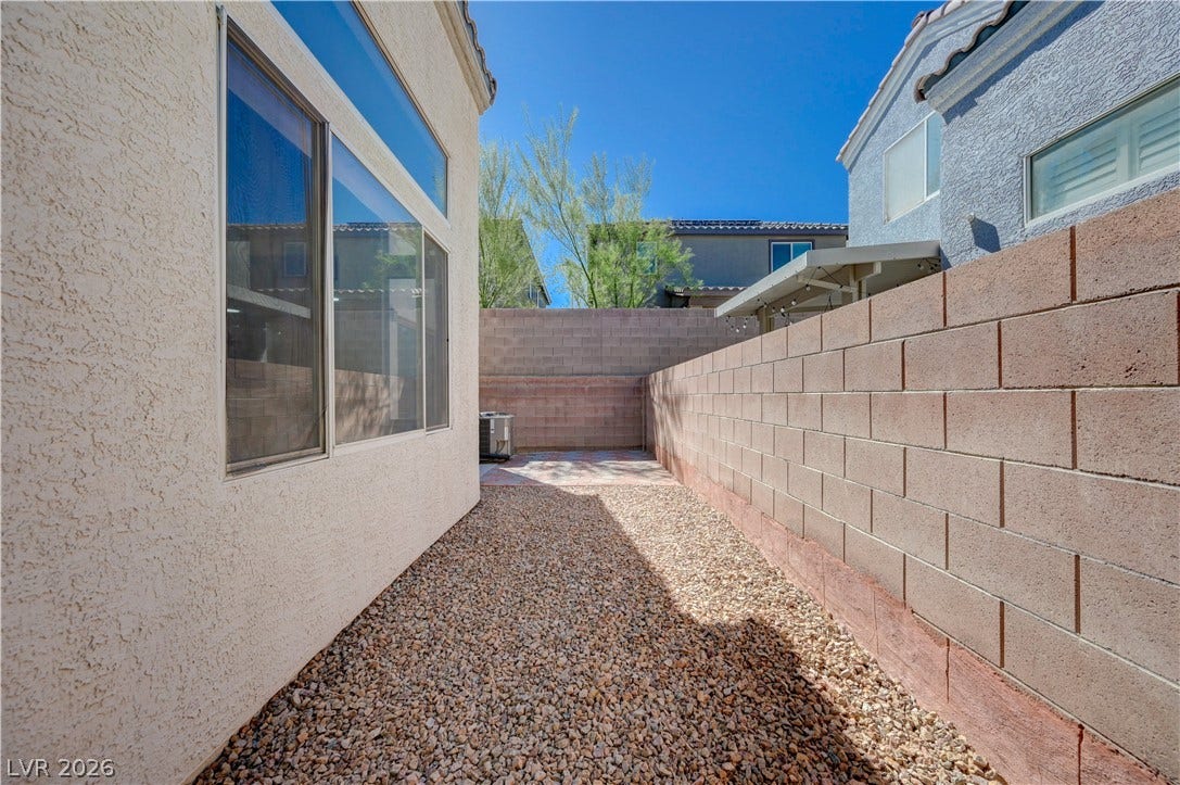 2706 Guidance Court, North Las Vegas, NV 89031 Low-maintenance gravel landscaping lines this private outdoor space enclosed by a sturdy block wall.