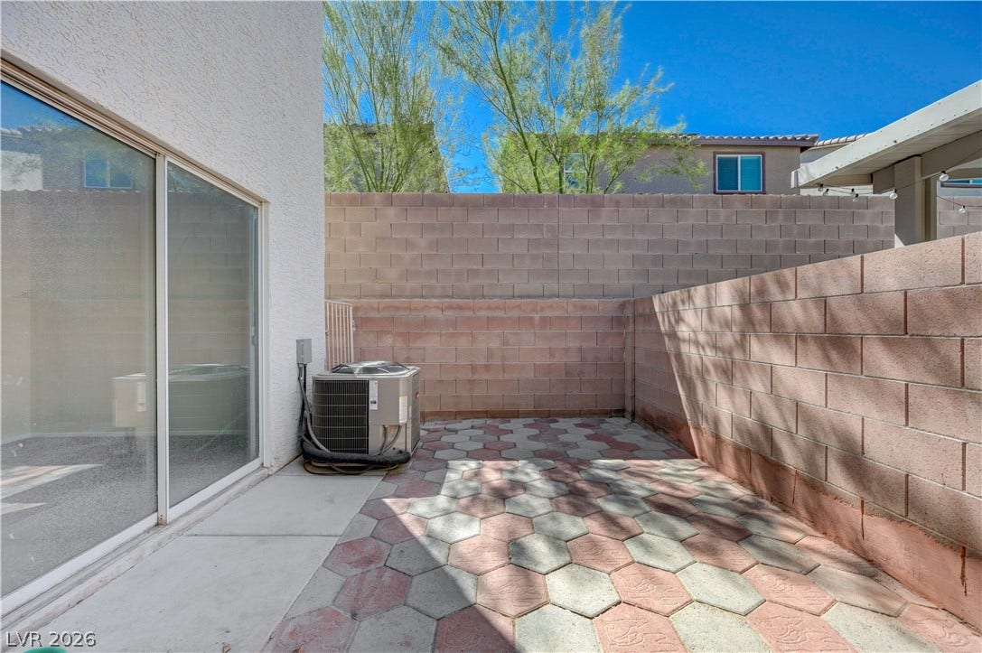 2706 Guidance Court, North Las Vegas, NV 89031 Block walls frame a private courtyard featuring interlocking paver stones.