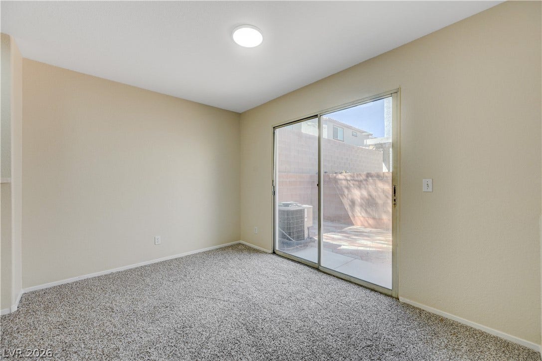 2706 Guidance Court, North Las Vegas, NV 89031 Sliding glass doors open from this carpeted room directly to the private rear patio.