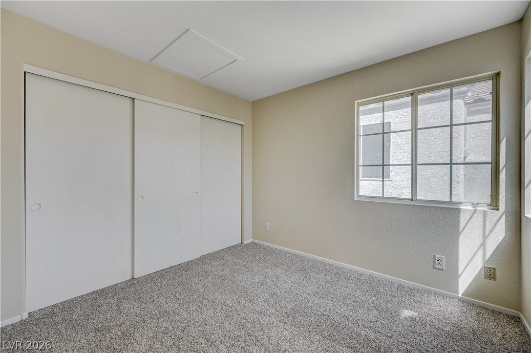 2706 Guidance Court, North Las Vegas, NV 89031 A quiet bedroom features plush carpeting and a large sliding closet.