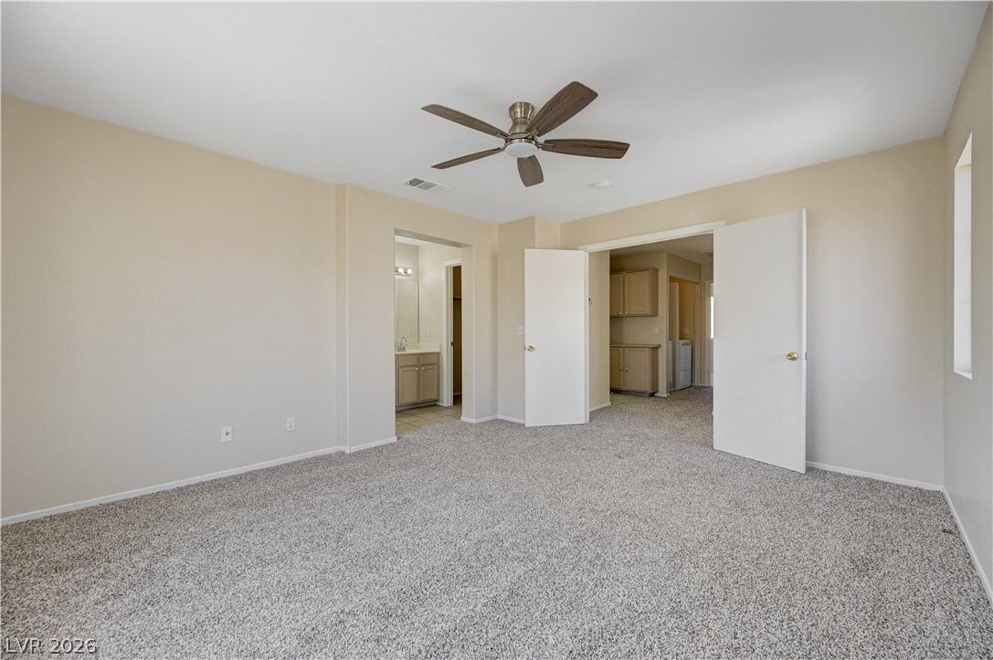 2706 Guidance Court, North Las Vegas, NV 89031 Plush carpeting and an open entryway characterize this versatile secondary bedroom space.
