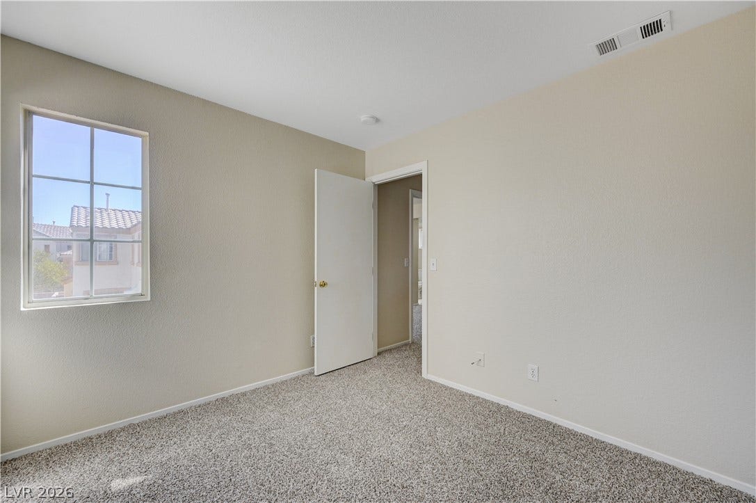 2706 Guidance Court, North Las Vegas, NV 89031 Plush carpeting and a classic multi-lite window define this versatile secondary space.