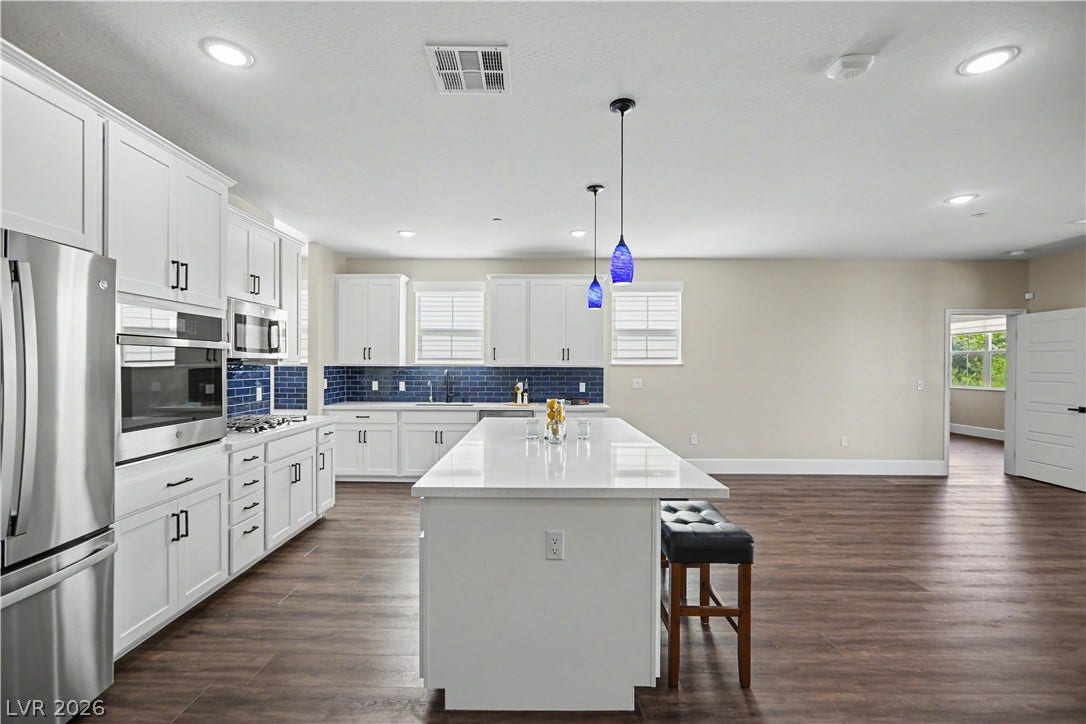 2555 Hampton Road, #11210, Henderson, NV 89052 Whether you are hosting or keeping it casual, this generous quartz island is the heart of the home, with room to gather and plenty of prep space.