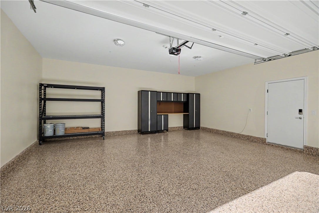 2555 Hampton Road, #11210, Henderson, NV 89052 The garage is a standout with a durable epoxy-coated floor, storage cabinets with workbench and heavy duty shelving, which will convey with the sale.