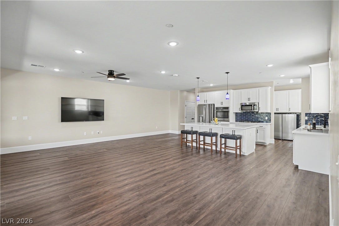 2555 Hampton Road, #11210, Henderson, NV 89052 Entertaining is effortless in this expansive open layout, where the living and dining area flows seamlessly into the kitchen and island seating.