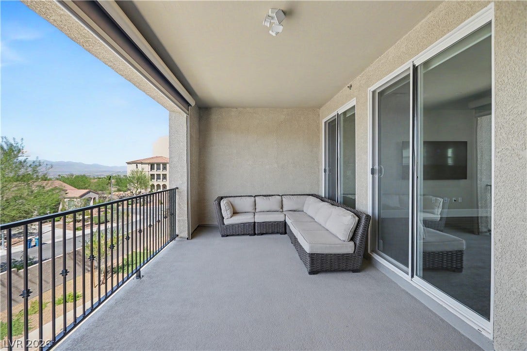 2555 Hampton Road, #11210, Henderson, NV 89052 Extend your living space outdoors on this spacious covered balcony, with beautiful mountain views and easy access through multiple sliding glass doors.