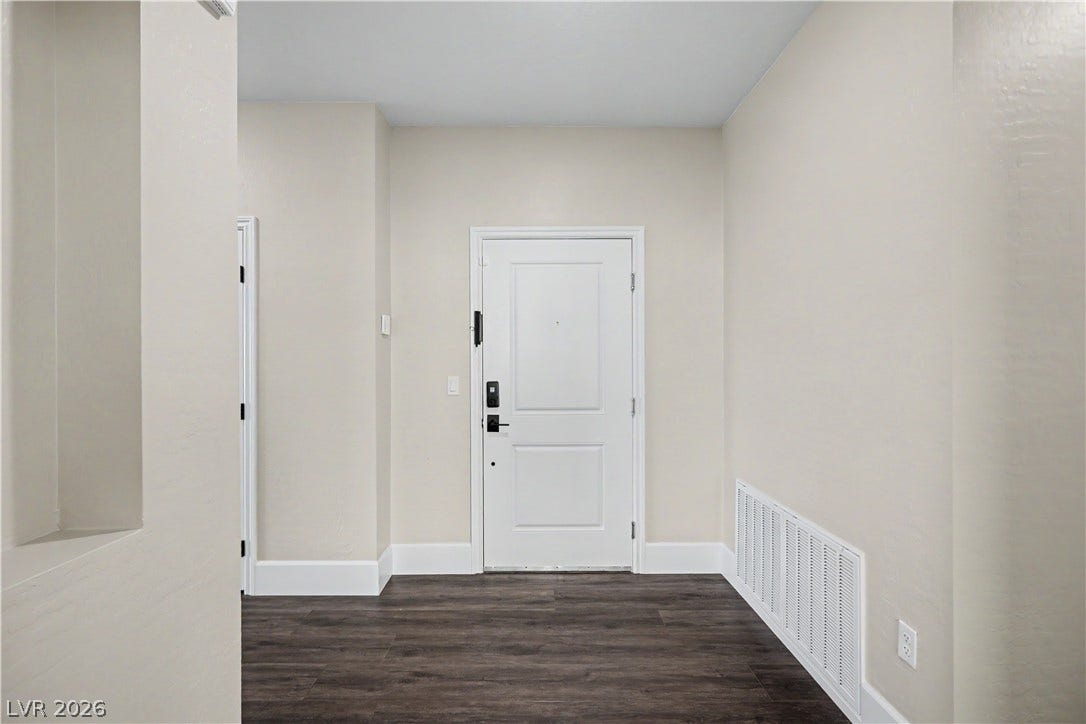 2555 Hampton Road, #11210, Henderson, NV 89052 A welcoming entryway with LVP flooring and 7 inch baseboards leads directly from the front door.