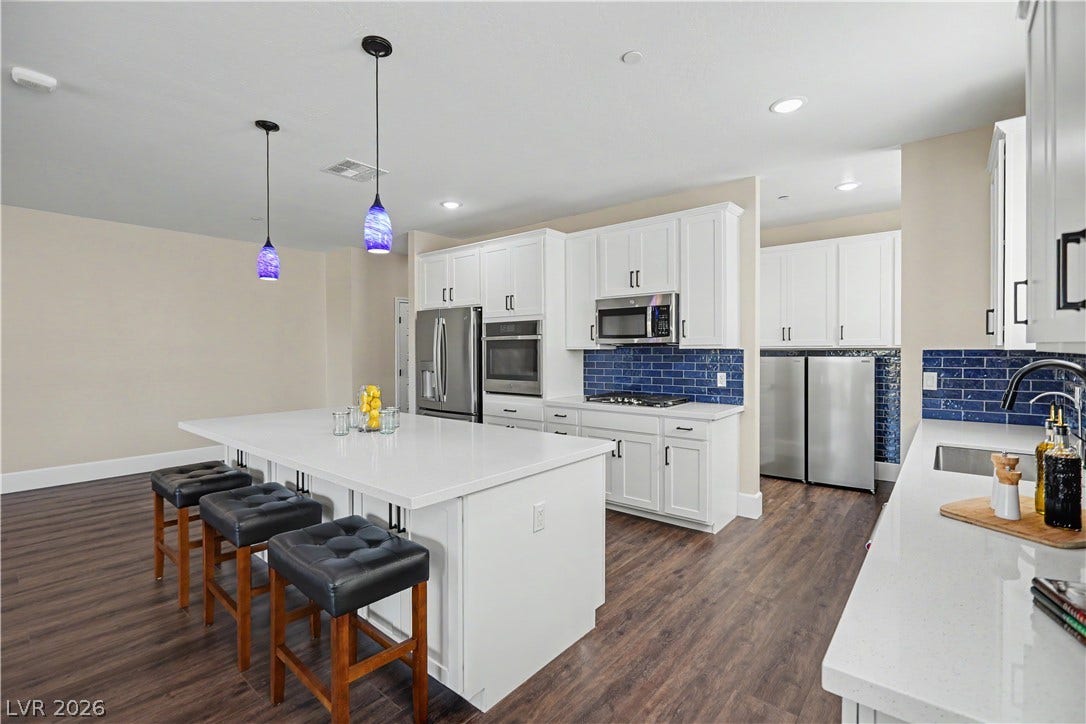 2555 Hampton Road, #11210, Henderson, NV 89052 Pull up a stool! The island seats three comfortably, perfect for morning coffee, a glass of wine or lemonade or chatting with the cook.