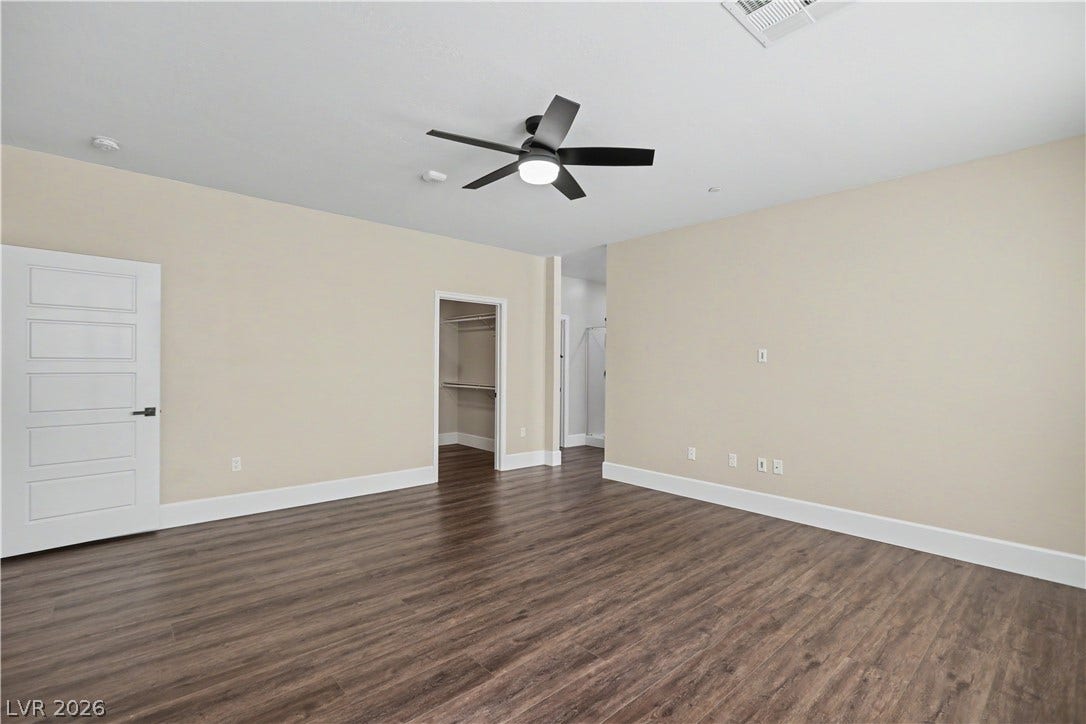 2555 Hampton Road, #11210, Henderson, NV 89052 The primary suite continues with a convenient walk-in closet, all tied together by the same rich wood-inspired LVP flooring.
