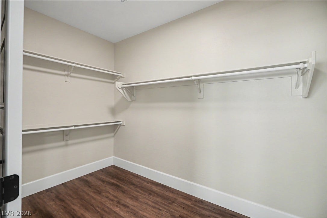 2555 Hampton Road, #11210, Henderson, NV 89052 This roomy walk-in closet makes getting ready a breeze, with ample hanging rods and space to spare.