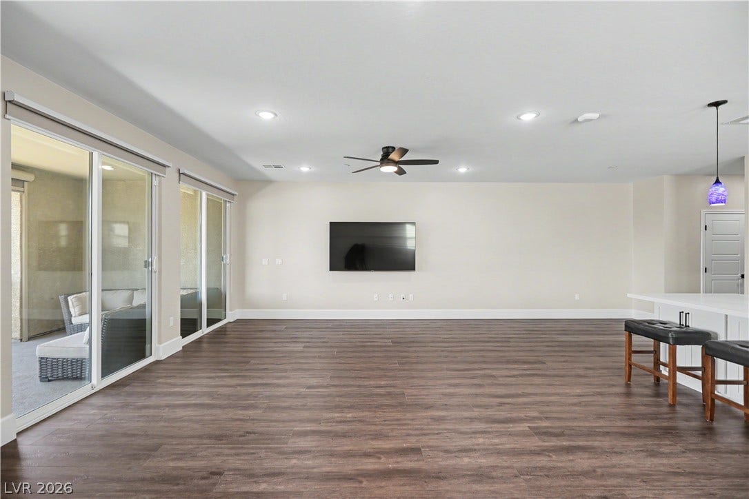 2555 Hampton Road, #11210, Henderson, NV 89052 This living room easily fits a sectional, chairs and more, so there is space for everyone to gather and unwind.