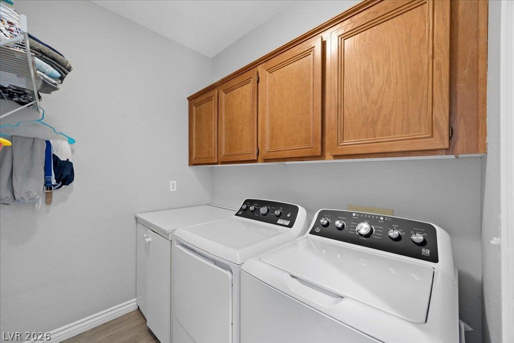 2386 Flute Avenue, Henderson, NV 89052 Ample wooden cabinetry and durable flooring create a highly functional laundry space.