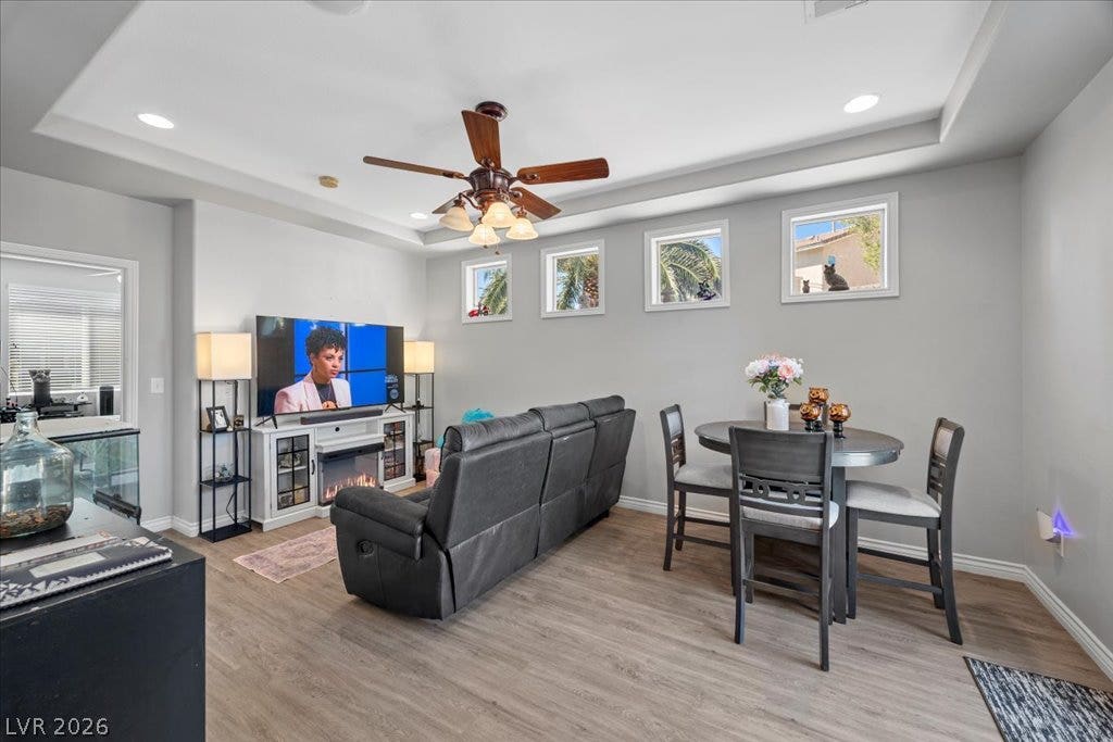 2386 Flute Avenue, Henderson, NV 89052 High ceilings and durable wood-look flooring enhance this inviting open living space.