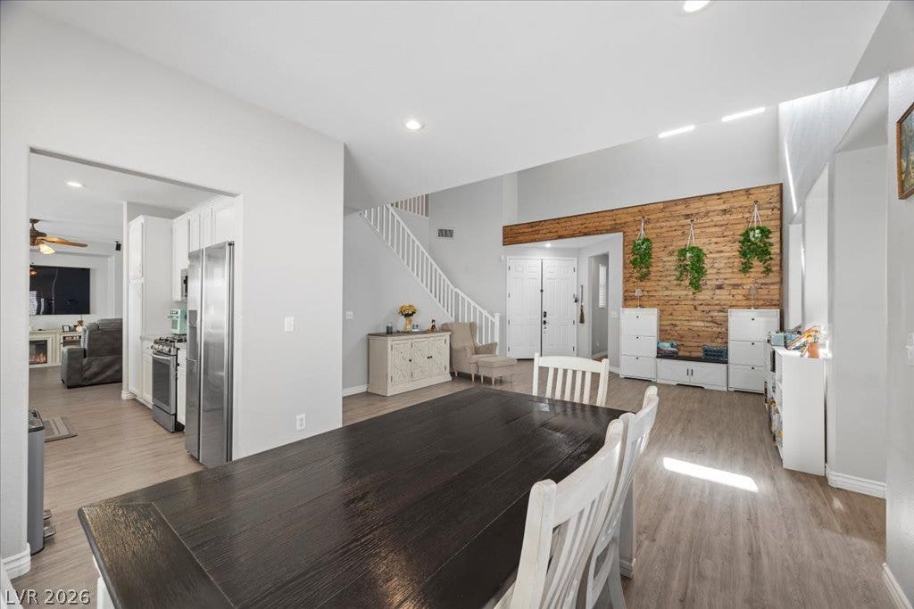 2386 Flute Avenue, Henderson, NV 89052 Gleaming wood floors and an airy open layout flow through the dining and living spaces.