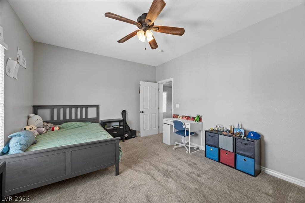 2386 Flute Avenue, Henderson, NV 89052 Plush carpeting and neutrally toned walls maximize the design potential of this secondary bedroom.