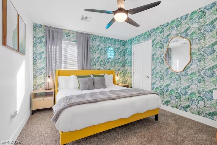 2713 Concord Street, North Las Vegas, NV 89030 Plush carpeting and textured walls frame a comfortable bedroom space full of natural light.
