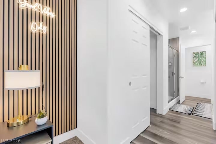 2713 Concord Street, North Las Vegas, NV 89030 A modern hallway reveals clean lines, recessed lighting, and resilient wood-look flooring.