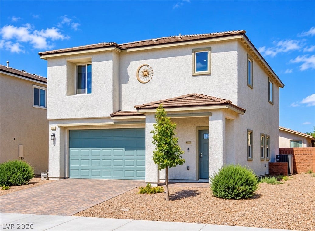 2713 Concord Street, North Las Vegas, NV 89030 A stucco exterior and tile roof define this two-story desert home.