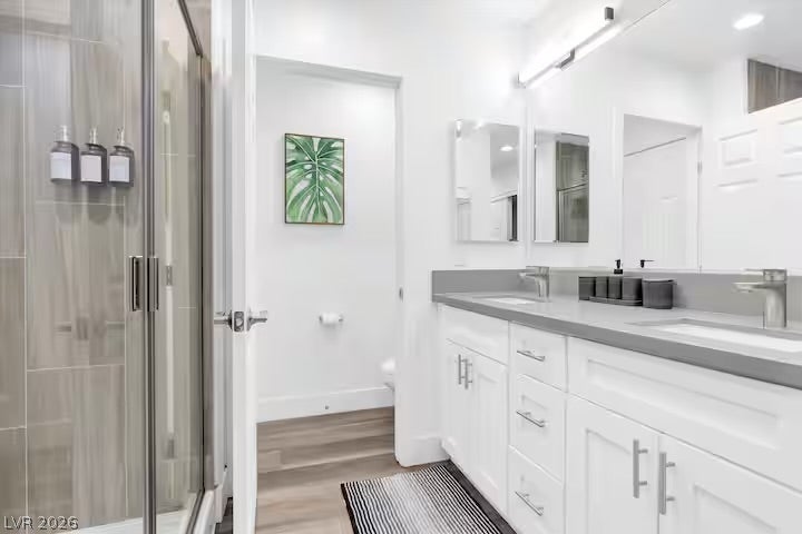 2713 Concord Street, North Las Vegas, NV 89030 A spacious double vanity and walk-in shower highlight this modern bathroom.