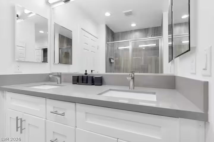 2713 Concord Street, North Las Vegas, NV 89030 Clean lines and a spacious dual vanity define this modern bathroom design.