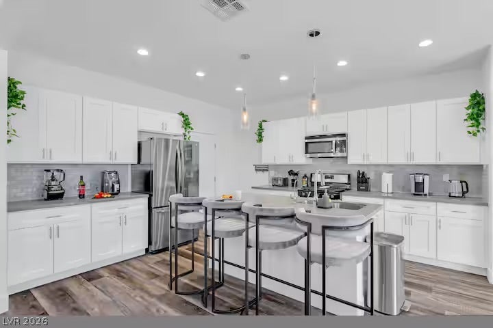 2713 Concord Street, North Las Vegas, NV 89030 Sleek contemporary cabinetry and a generous central island define this open culinary space.
