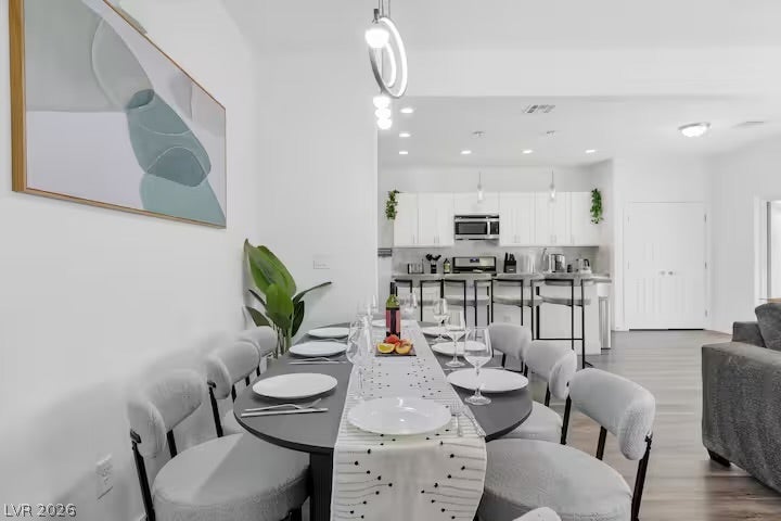 2713 Concord Street, North Las Vegas, NV 89030 An open floor plan seamlessly connects the welcoming dining space to a modern kitchen.