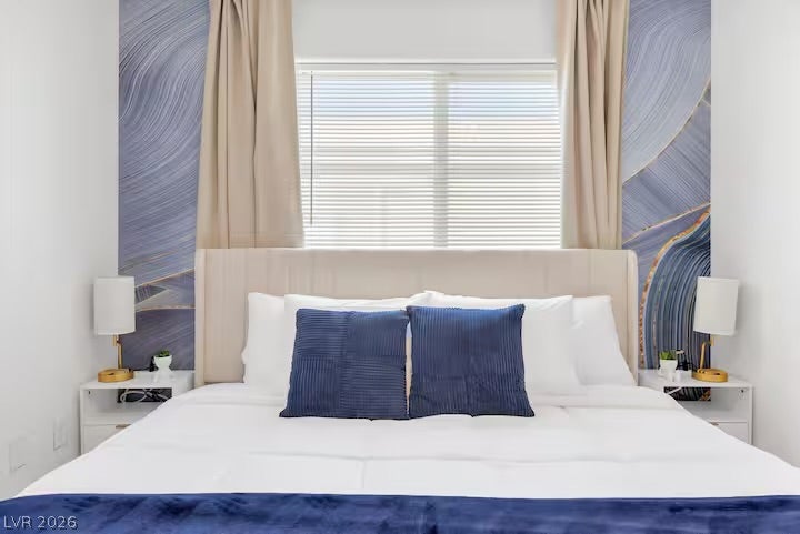 2713 Concord Street, North Las Vegas, NV 89030 A spacious window provides abundant natural light to this serene bedroom retreat.
