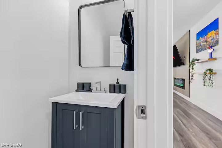 2713 Concord Street, North Las Vegas, NV 89030 A modern vanity anchors this stylish half bath with clean lines.