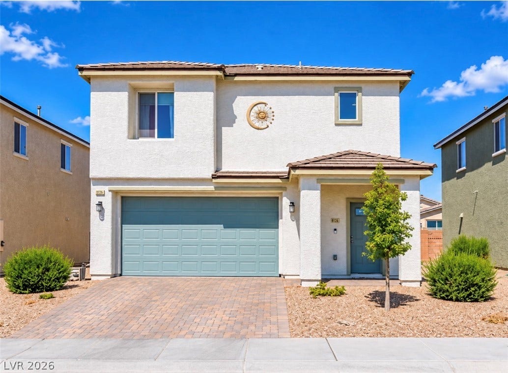 2713 Concord Street, North Las Vegas, NV 89030 Clean lines and a paved driveway define the exterior of this modern multi-level home.